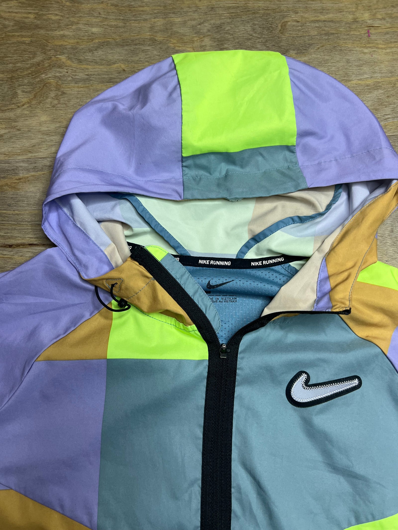 Nike Neon “Wild Run Patchwork” Windbreaker Jacket